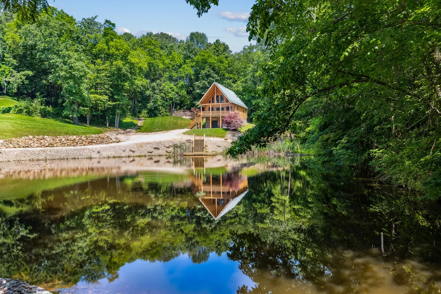 Cabin reflected in a private pond